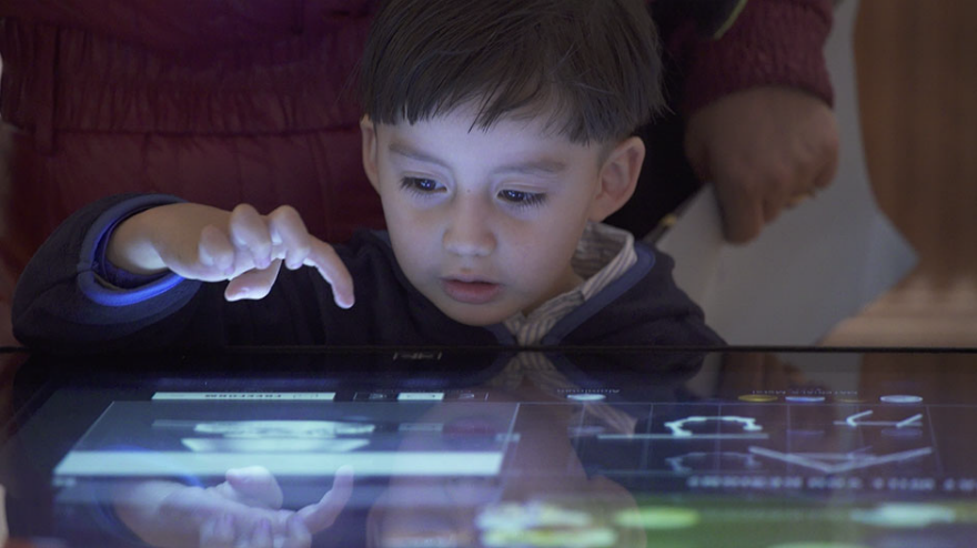 A young visitor at a table